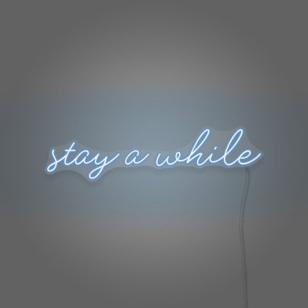 A glowing neon sign with the phrase 'Stay A While' in vibrant colors, evoking warmth and hospitality.