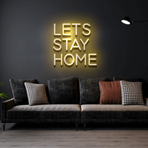 A glowing neon sign with the phrase 'Let's Stay Home' in vibrant colors, evoking warmth and relaxation.