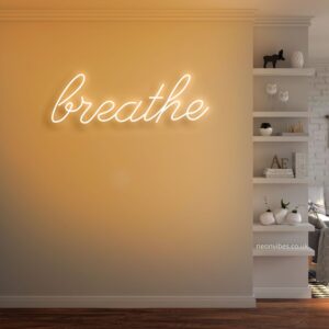 A glowing neon sign with the word 'Breathe' in calming colors, evoking tranquility and mindfulness.