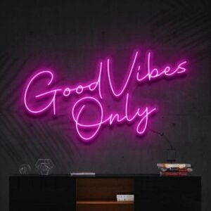 A glowing neon sign with the phrase 'Good Vibes Only' in vibrant colors, evoking positivity and happiness.