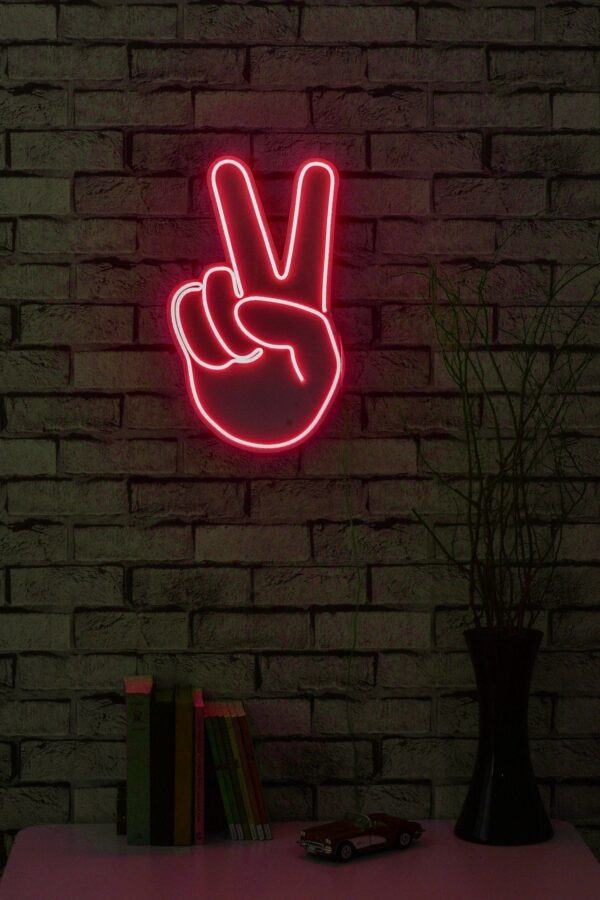 A glowing neon sign depicting the victory hand gesture in vibrant colors, symbolizing triumph and success.