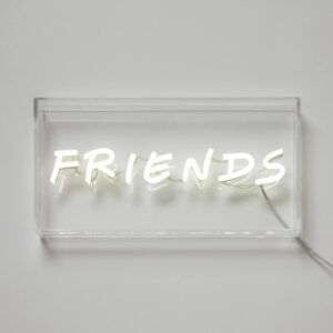 A glowing neon sign with the word 'Friends' in vibrant colors, evoking warmth and camaraderie.