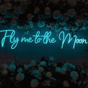 A glowing neon sign with the phrase 'Fly Me to the Moon' in vibrant colors, evoking dreams of exploration and adventure.