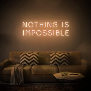 A glowing neon sign with the phrase 'Nothing is Impossible' in vibrant colors, evoking optimism and determination.