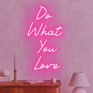 A glowing neon sign with the phrase 'Do What You Love' in vibrant colors, evoking motivation and positivity.