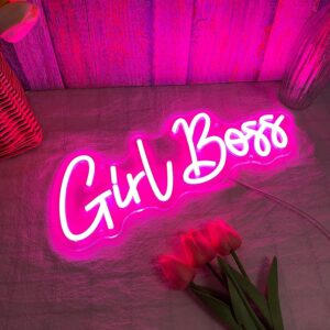 A glowing neon sign with the phrase 'Girl Boss' in bold, vibrant colors, evoking confidence and determination.