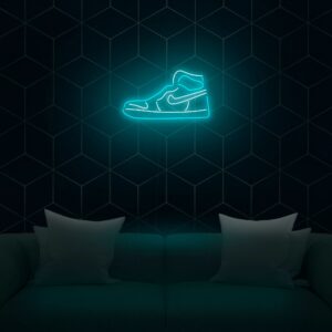 Neon sign featuring a stylized shoe and sneaker design in bright colors, glowing vibrantly against a dark background.