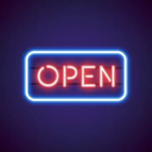 Bright 'OPEN' neon sign in vibrant red letters, illuminated against a dark backdrop, signaling the welcoming entrance of a business.